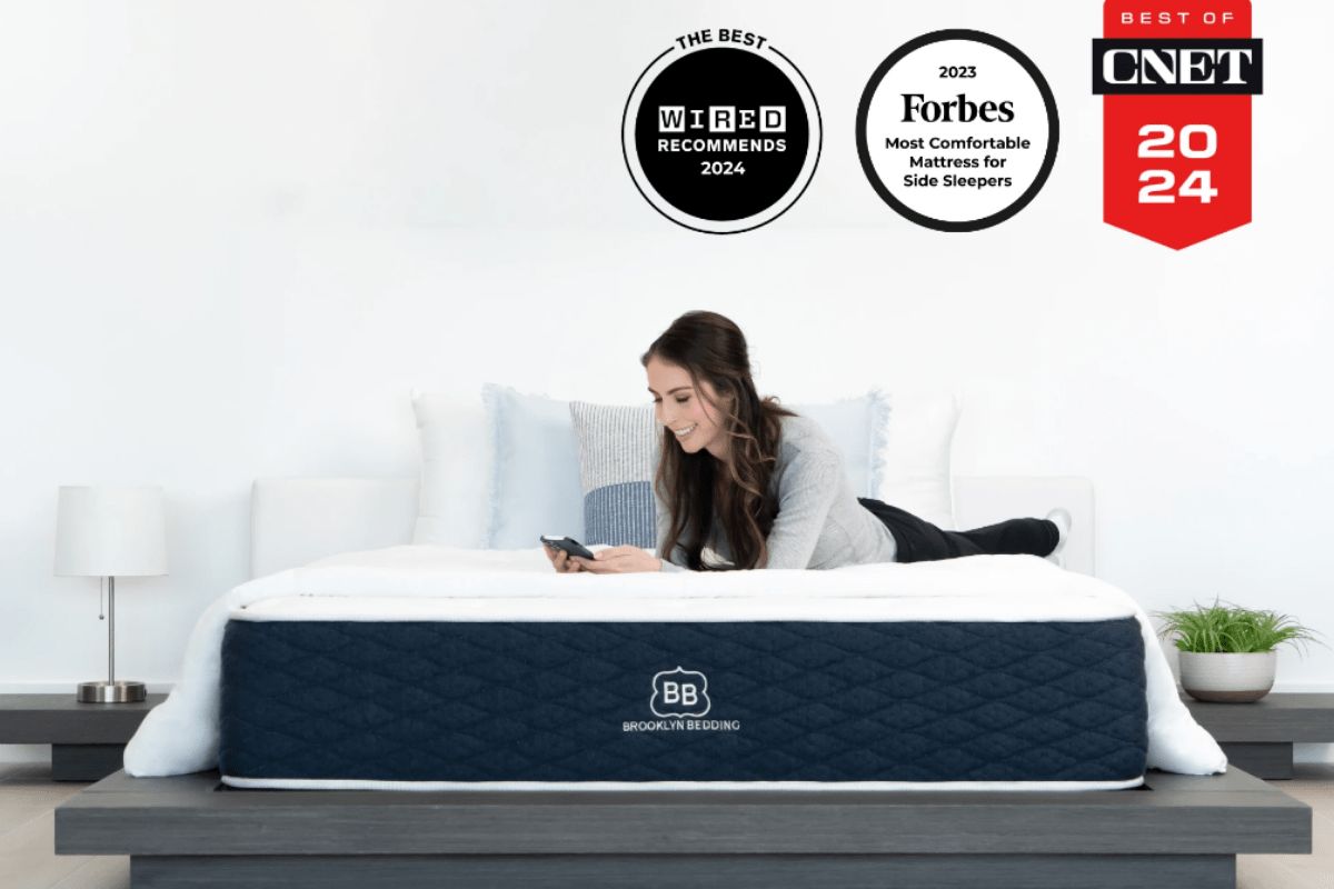 User lying on Brooklyn Bedding Signature Hybrid mattress highlighting comfort claims versus real user feedback