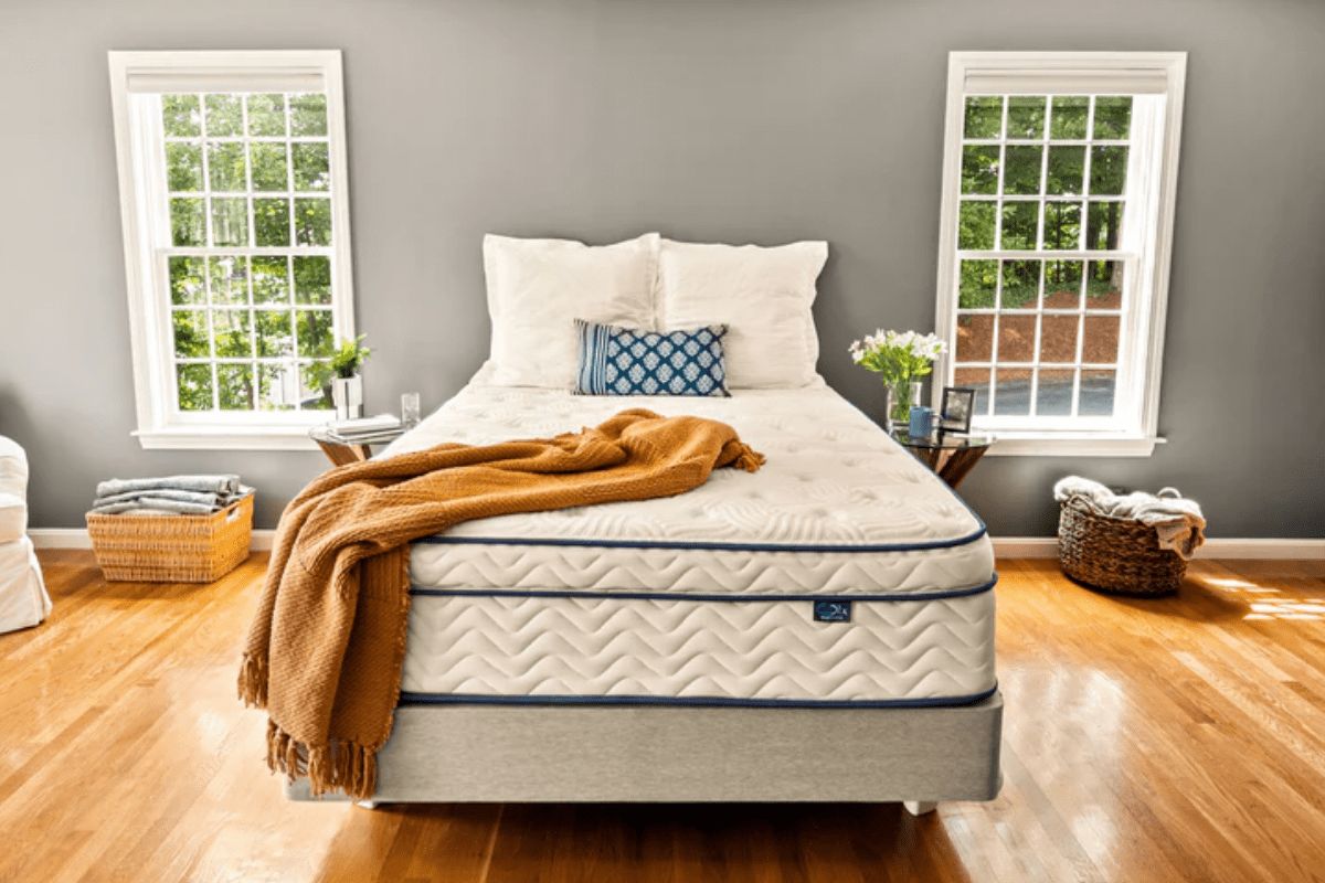 DLX Premier Hybrid mattress in bedroom showing overall design and materials used for safe sleep