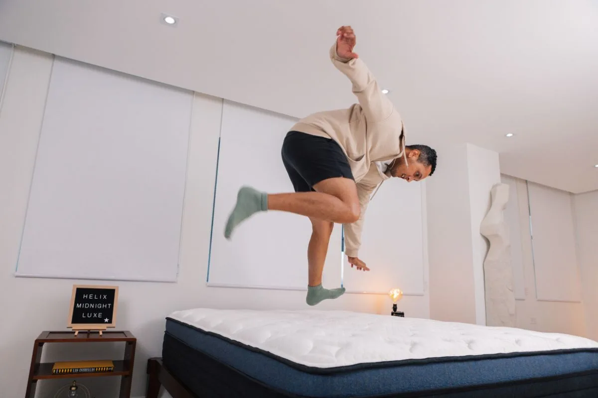 A man about to land on the Helix Midnight Luxe.