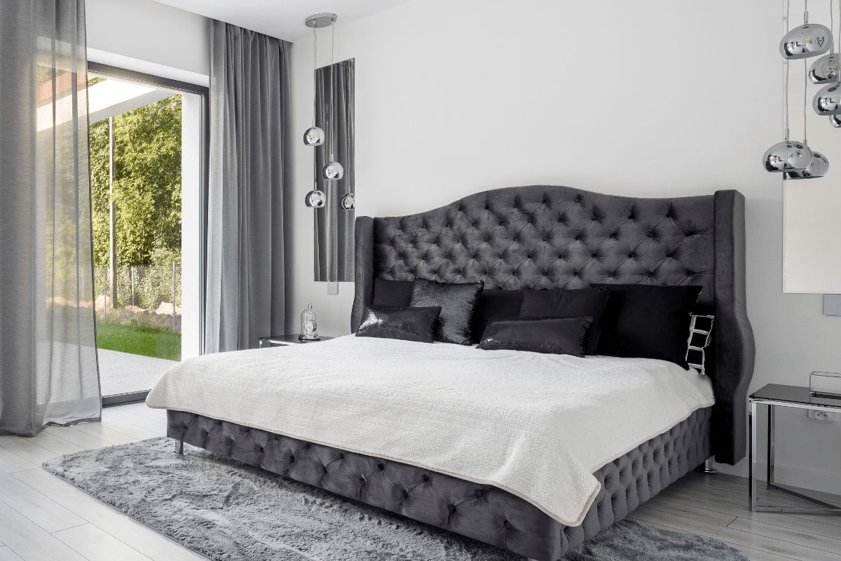 How Big Is a King Size Bed? Large king size bed in modern bedroom highlighting spacious sleeping area and room fit