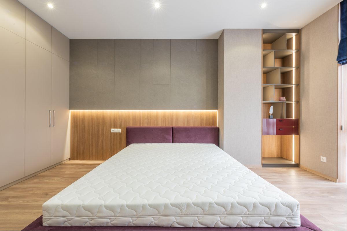 What Is a King Size Bed? King size bed in spacious modern bedroom showing scale and room requirements
