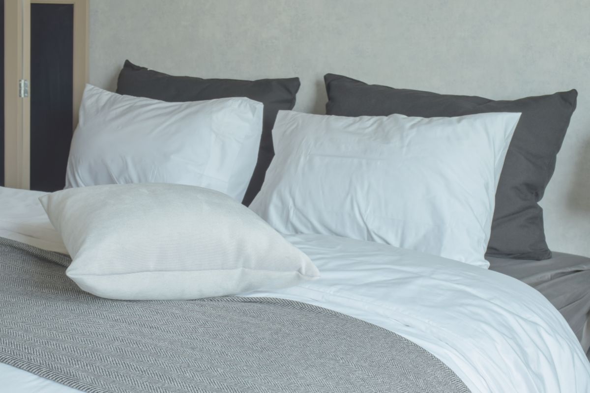 King size mattress with multiple pillows showing width and sleeping space