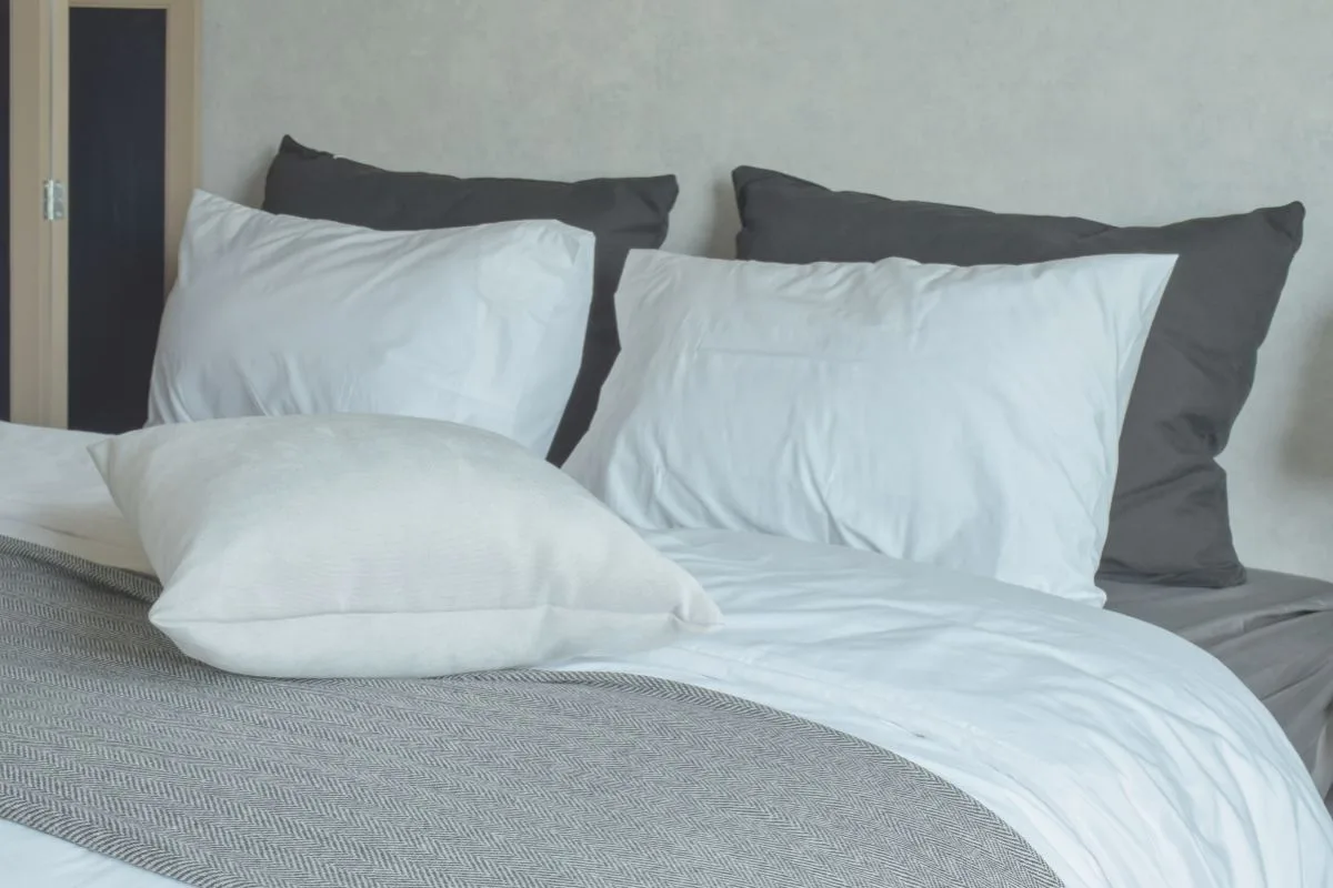 King size mattress with multiple pillows showing width and sleeping space