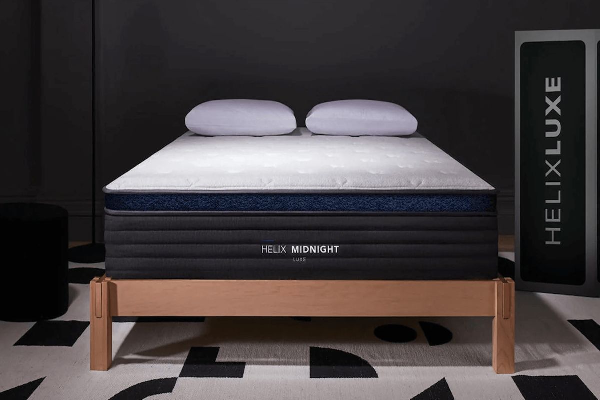 Helix Midnight Luxe California king mattress showcasing balanced comfort and support on modern bed frame