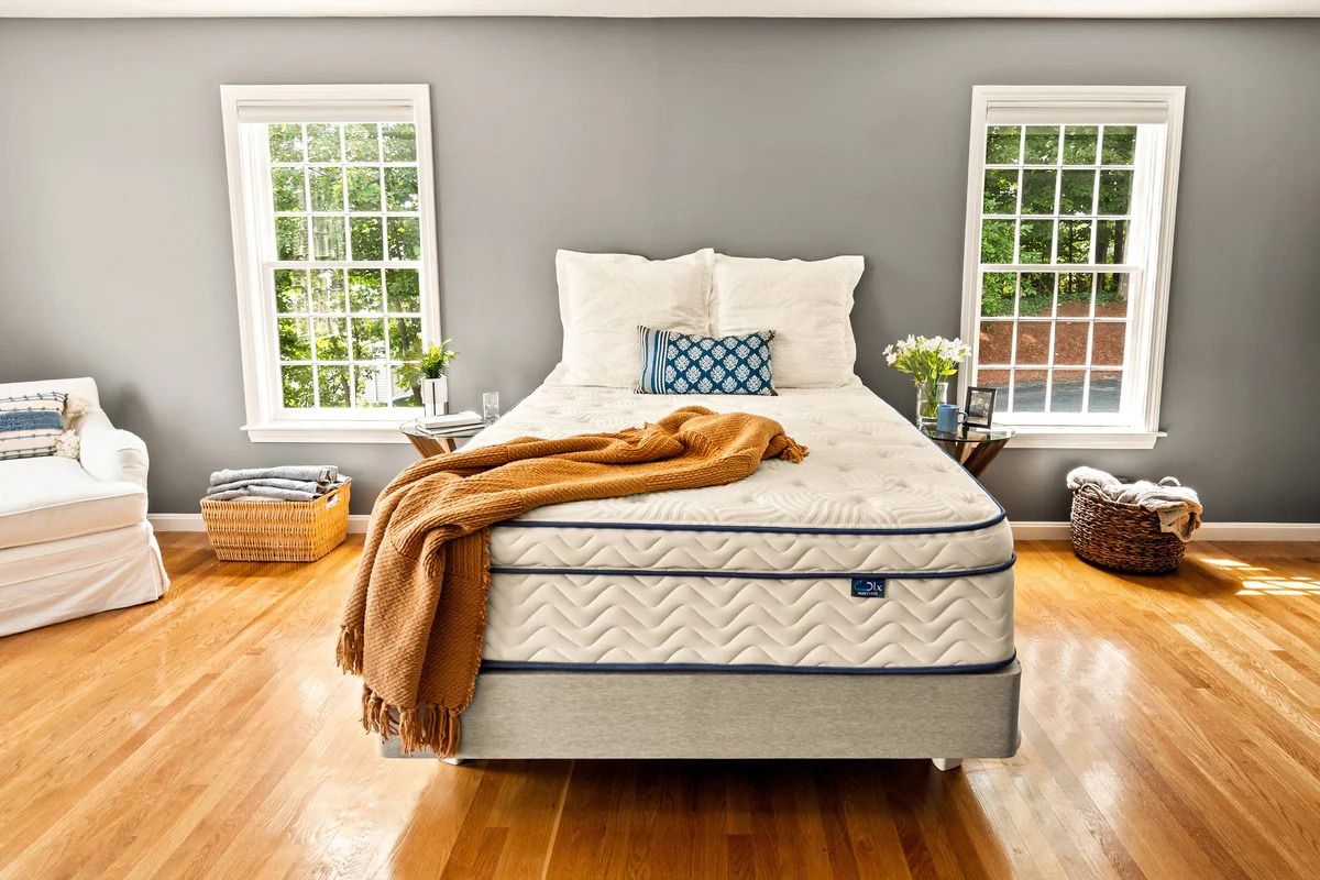 Full size mattress in cozy bedroom setup demonstrating everyday comfort, support, and sleep quality