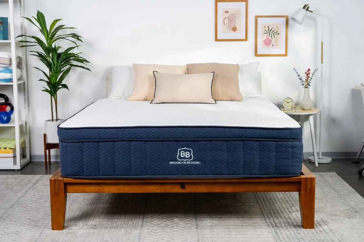 Brooklyn Bedding Aurora Luxe Cooling mattress on wooden bed frame in modern bedroom setup