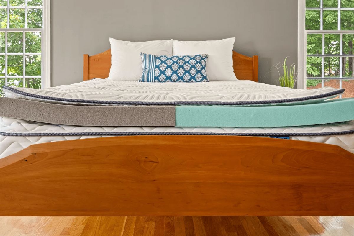 DLX Premier Hybrid mattress layers displayed on bed frame highlighting proper setup to avoid warranty issues