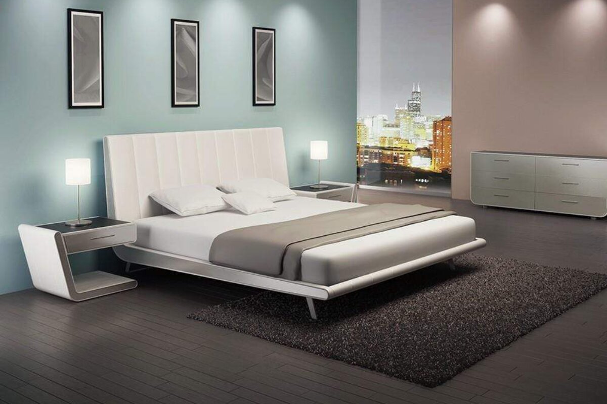 how-big-is-a-california-king-bed-why-is-it-called-a-california-queen-bed sleek white california king platform bed with tall upholstered headboard in a modern luxury bedroom