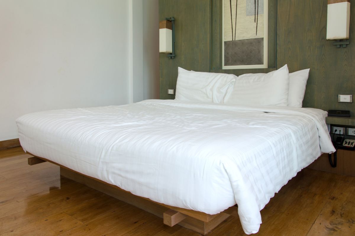 California king bed in bedroom showing extended length and spacious sleep surface