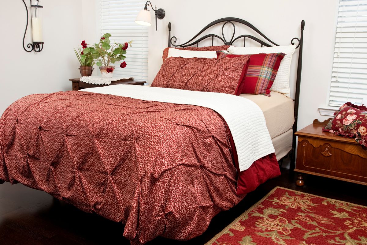 Queen size bed in a traditional bedroom showing typical mattress length and sleeping space