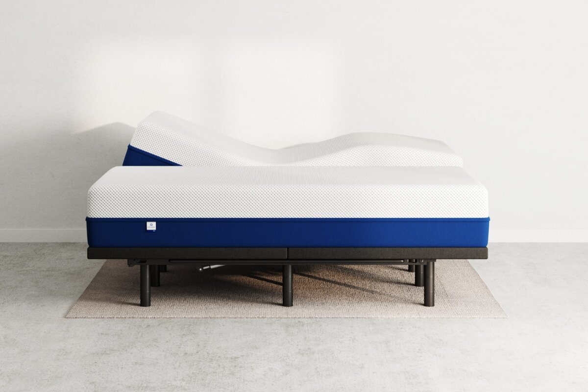 side view of split king adjustable mattress with contoured shape on modern bed frame