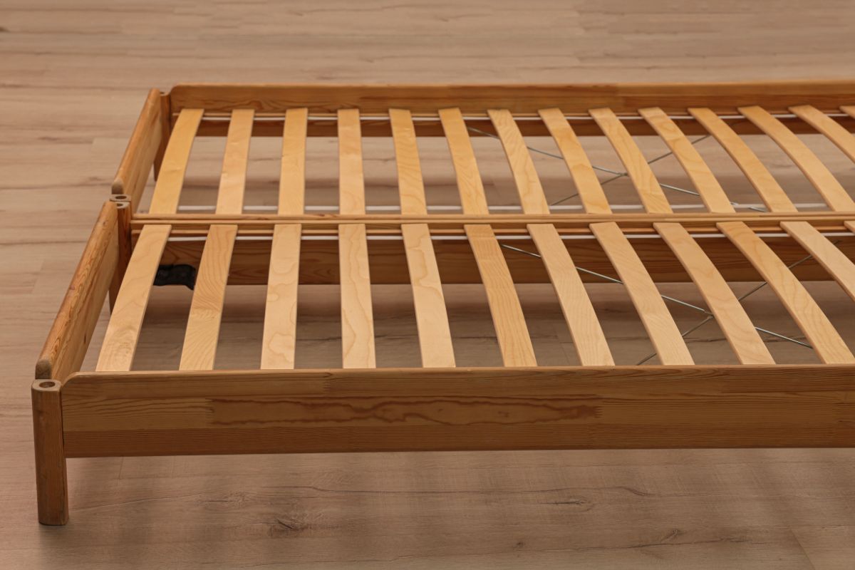 How Wide is a California King Bed? Wooden bed frame with slats illustrating support structure for a California King mattress