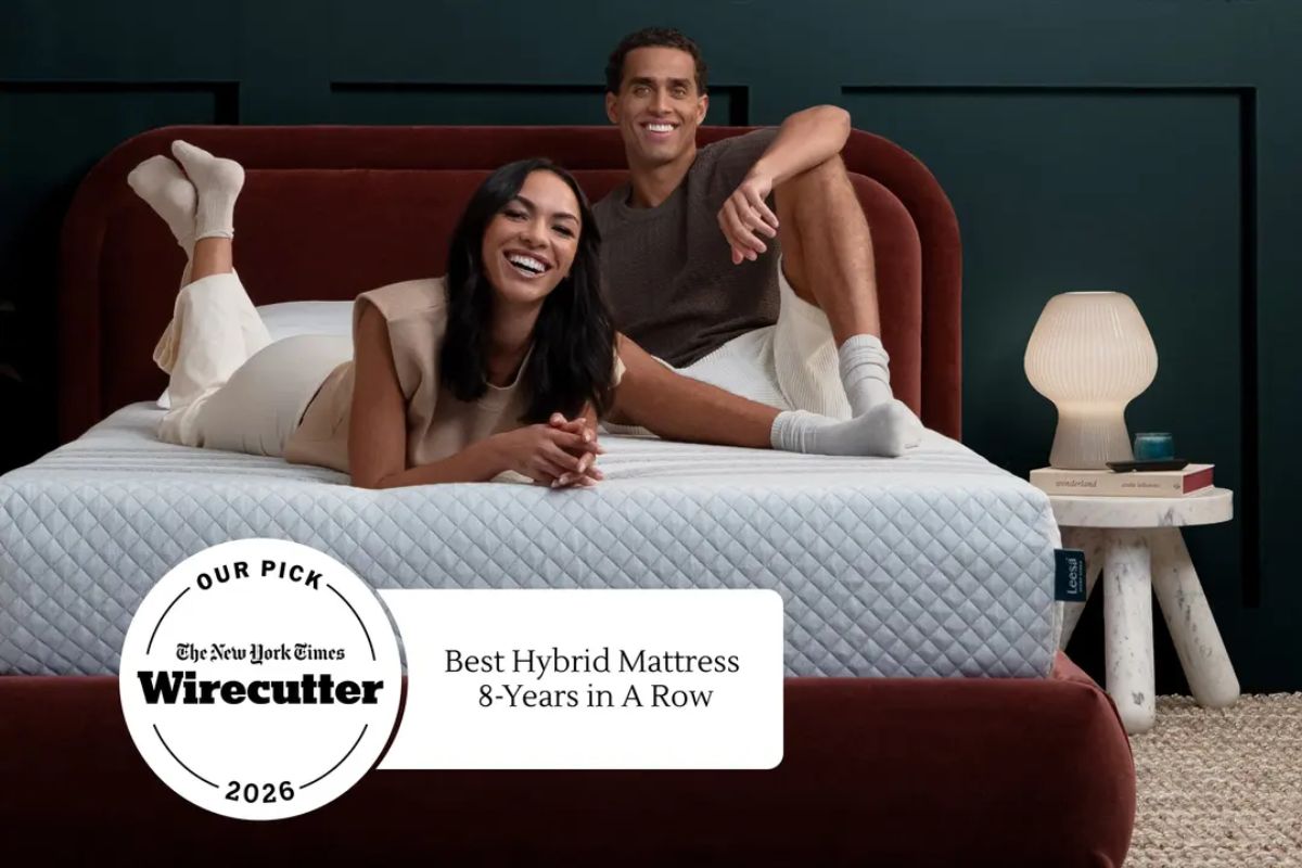 A couple lying down on the Leesa Sapira Hybrid mattress with an "Best Hybrid 8-years in a row" mark from The New York Times Wirecutter.