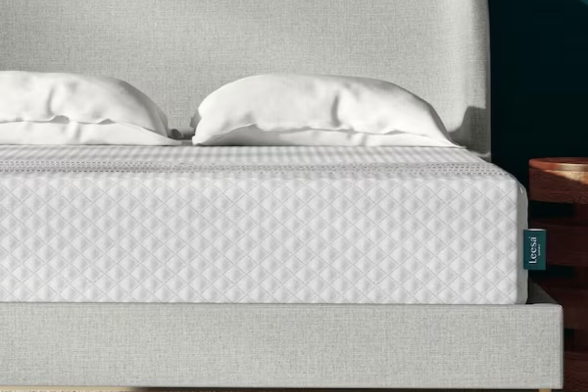 close up of leesa sapira hybrid mattress showing quilted cover and layered edge support on modern bed