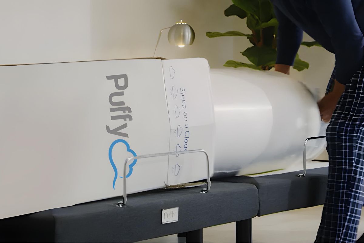 Puffy Cloud Mattress being compressed and packed back into box during return process