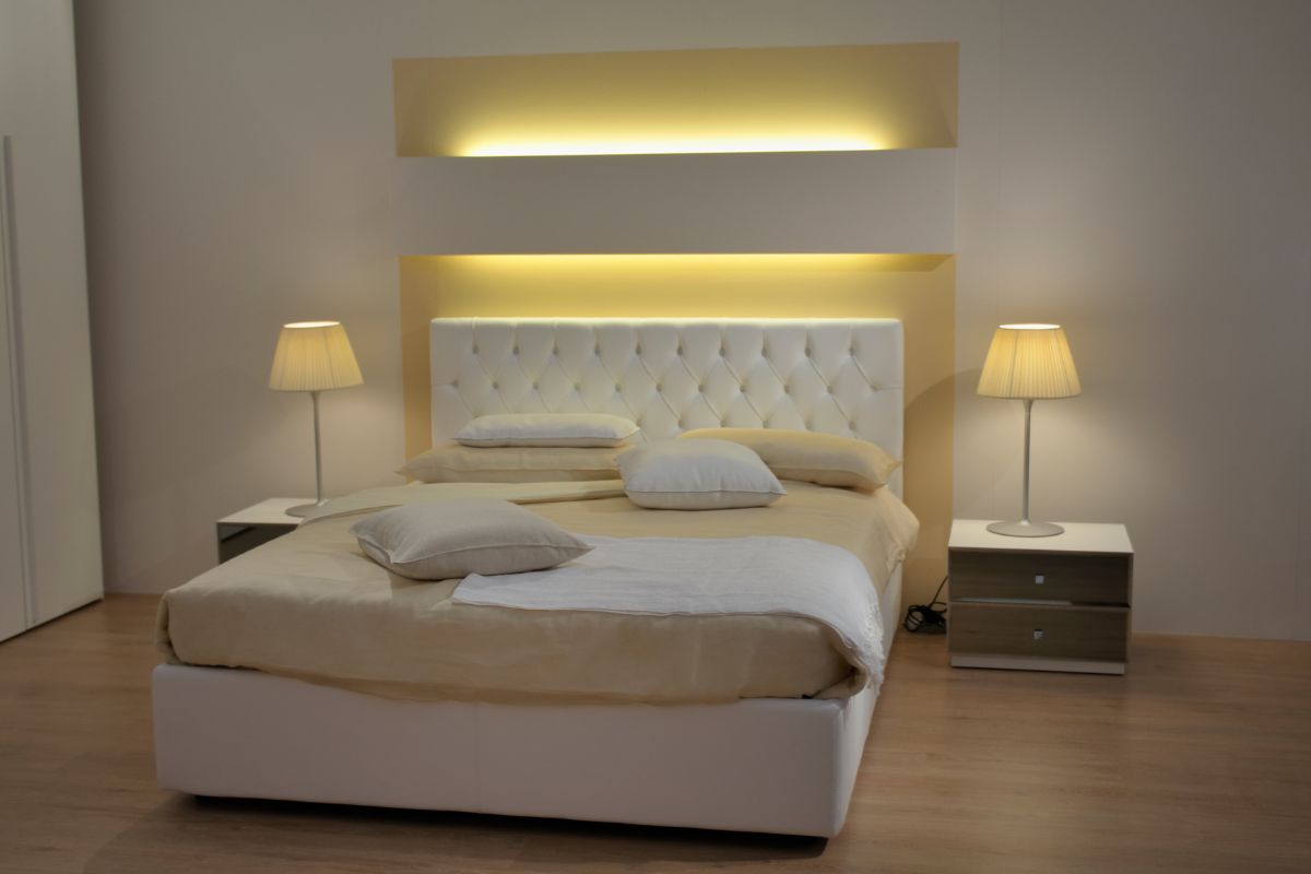 What Size Is a Queen Mattress? Standard queen bed setup with headboard and nightstands illustrating common queen mattress size in a room