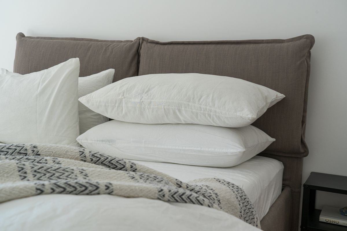 What Size Is a Queen Mattress? Close-up of pillows and bedding on a queen mattress highlighting width and sleeping space