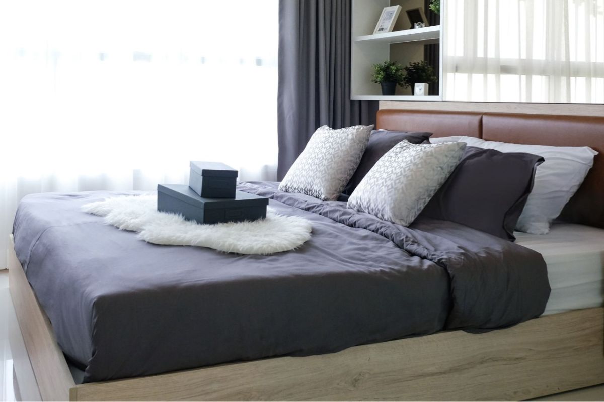 What Size Is a Queen Mattress? Queen size mattress styled in a modern bedroom showing typical dimensions and space for two sleepers