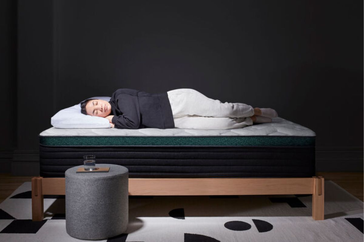 A woman sleeping on the Helix Twilight Luxe.