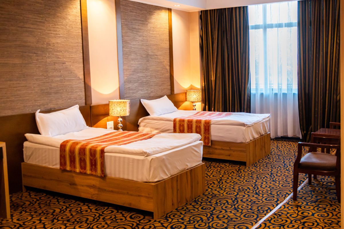 How Deep is a Standard Twin Mattress? Two twin mattresses in a hotel room illustrating standard depth and overall profile