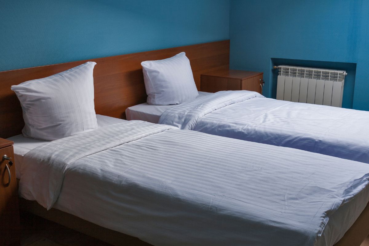 How Deep is a Standard Twin Mattress? Side-by-side twin beds highlighting mattress height and depth in a real bedroom setup