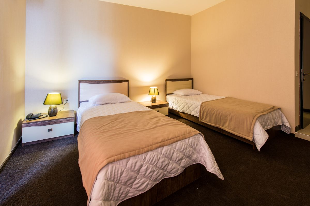 How Deep is a Standard Twin Mattress? Twin beds in a room showing typical mattress thickness and depth on standard bed frames