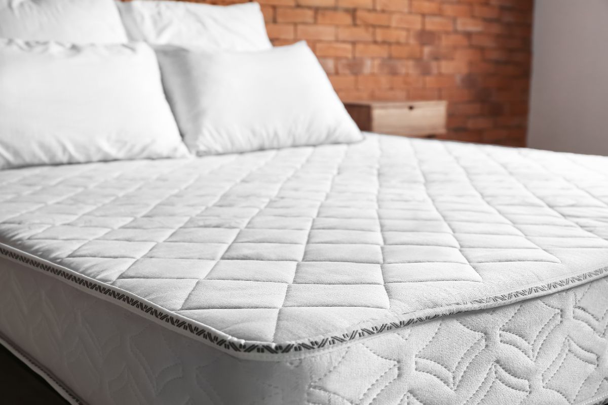 How Much Is a Full Size Mattress? Close-up of a full size mattress surface showing materials and build quality that affect cost