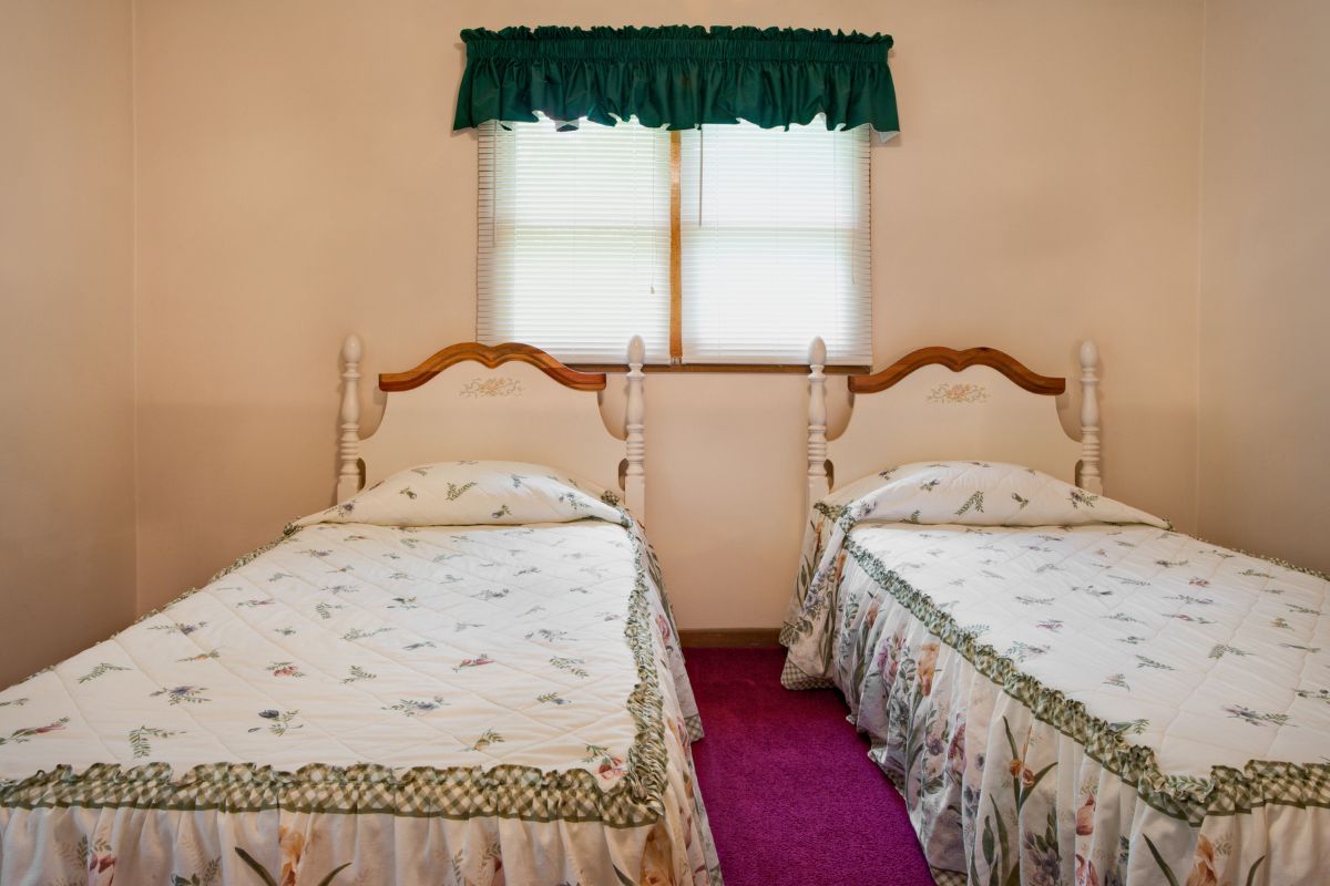 How Wide is a Twin Bed? Pair of twin beds side by side showing typical width and layout in shared rooms