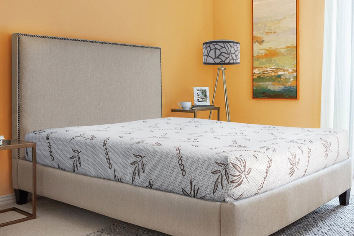 short queen mattress on upholstered bed frame in modern bedroom