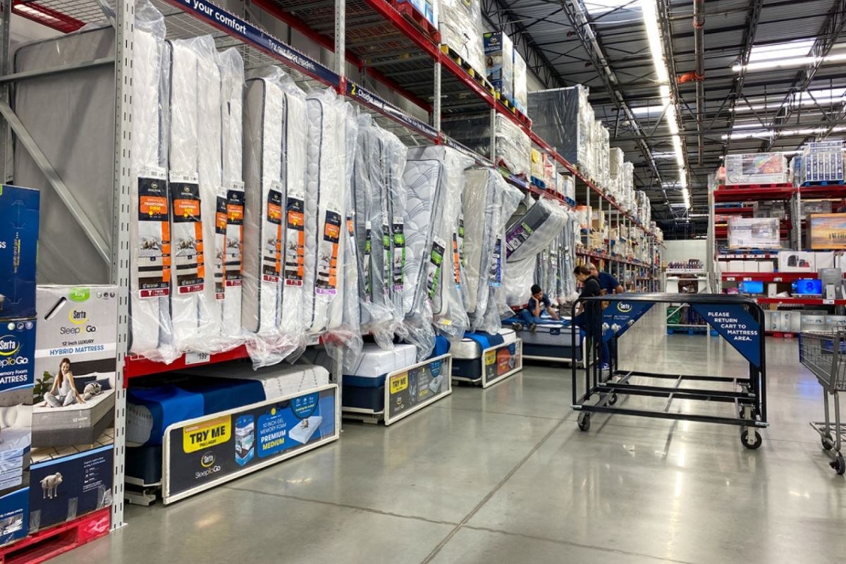 Warehouse-style mattress section displaying multiple options available for Twin XL mattress purchases