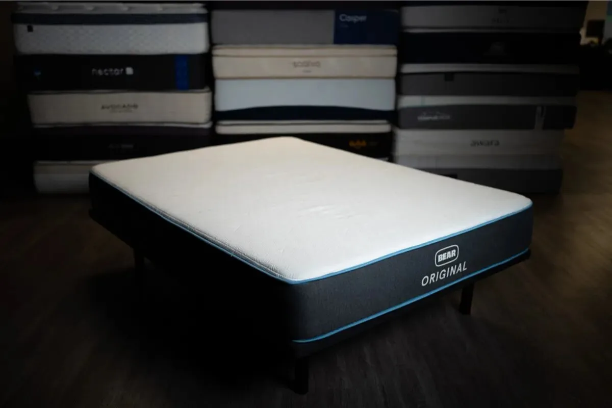 bear original mattress showcased in mattress testing room with other mattresses in background