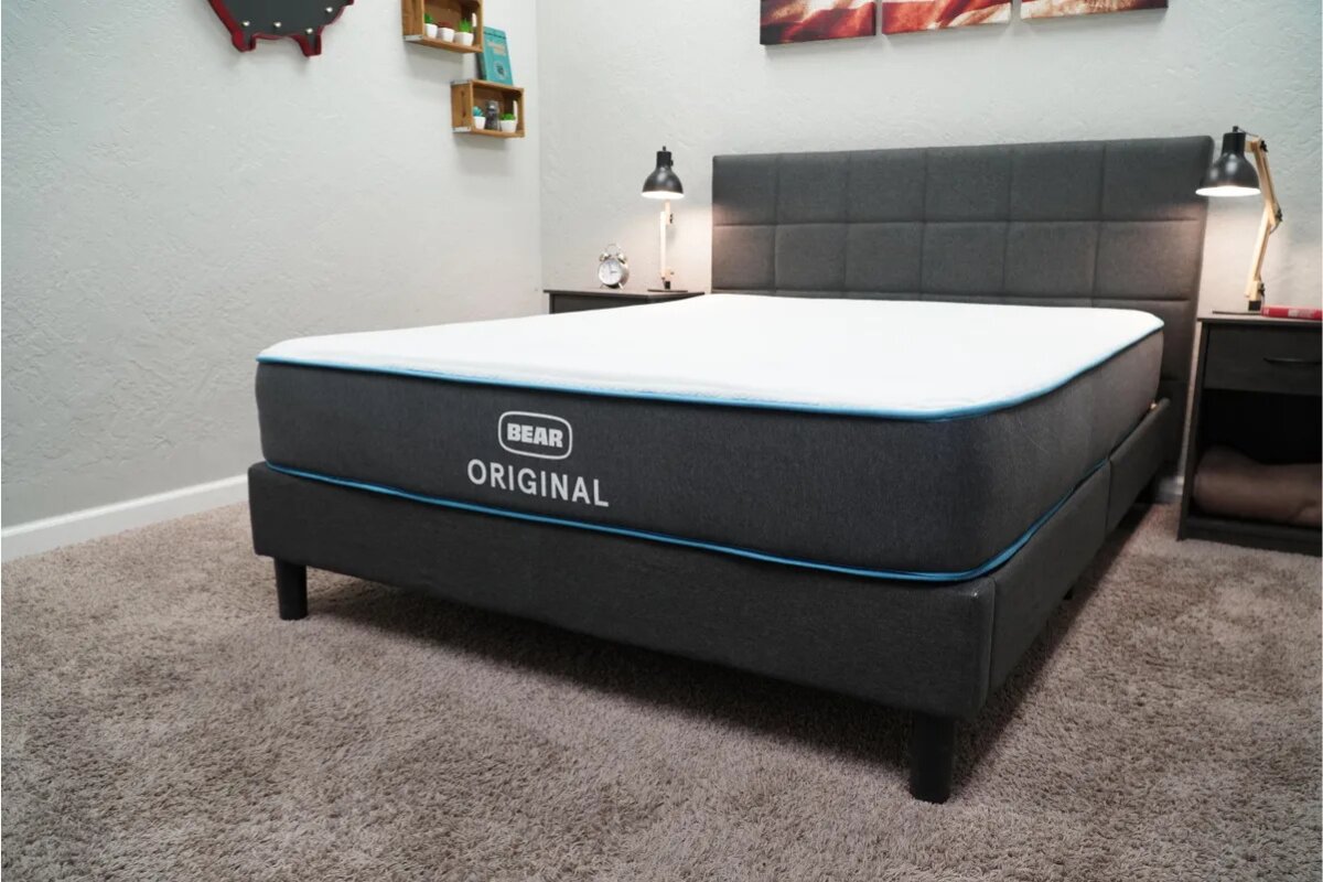 bear original mattress displayed on upholstered bed frame in modern bedroom