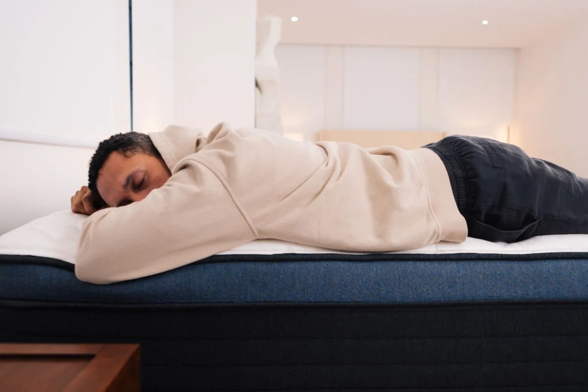 A man sleeping on a Helix Midnight Luxe.