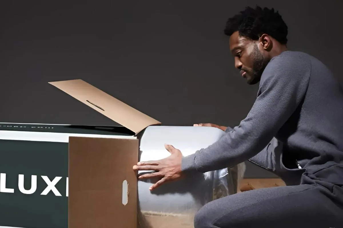 Customer unboxing a Helix Sunset Luxe mattress during the return or replacement process after a sleep trial