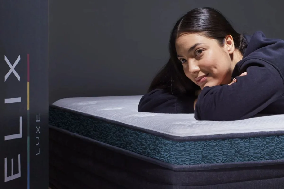 Sleeper resting on the Helix Sunset Luxe mattress illustrating real user comfort experiences and plush feel