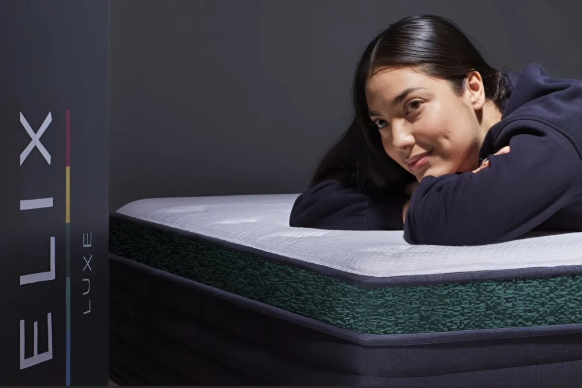 User testing Helix Twilight Luxe mattress surface demonstrating real sleep experience and firmness feel