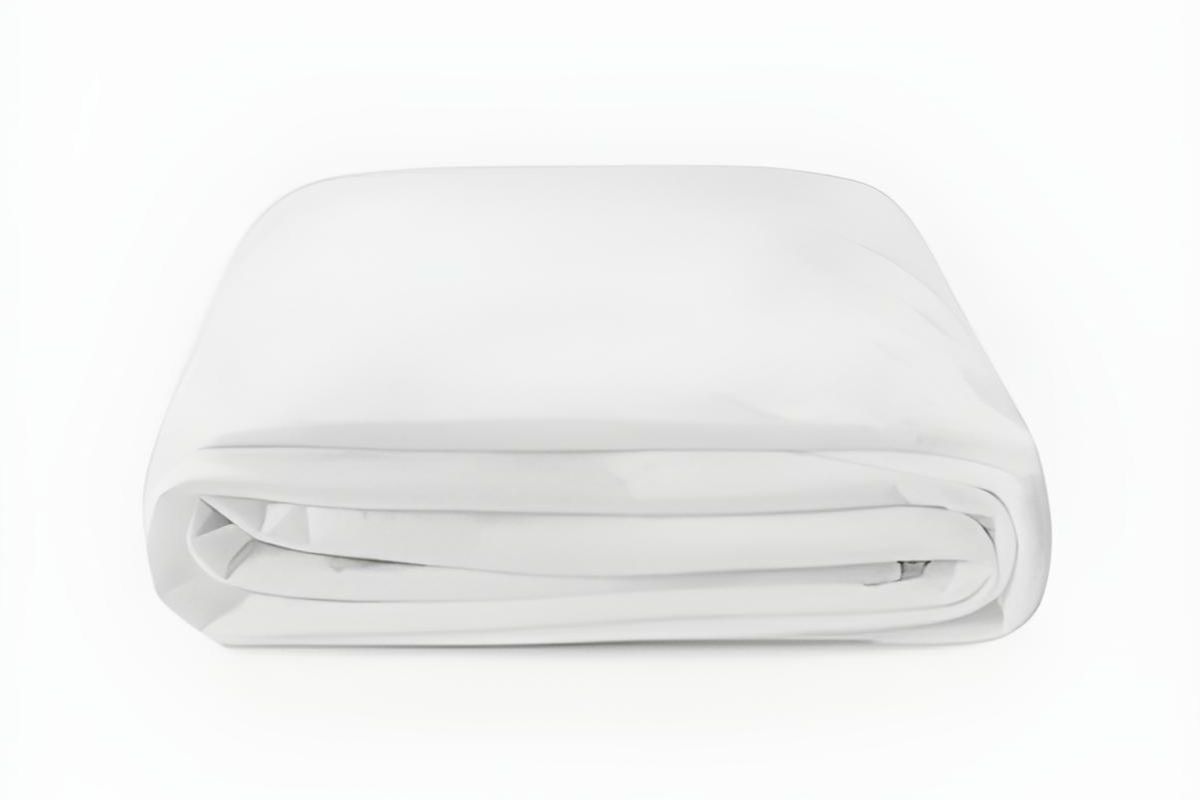 Mattress protector neatly covering bed to help prevent stains and protect warranty eligibility