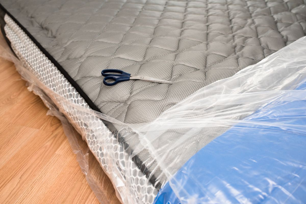 How to Store a Twin Mattress? Twin mattress wrapped in plastic cover for protection during storage