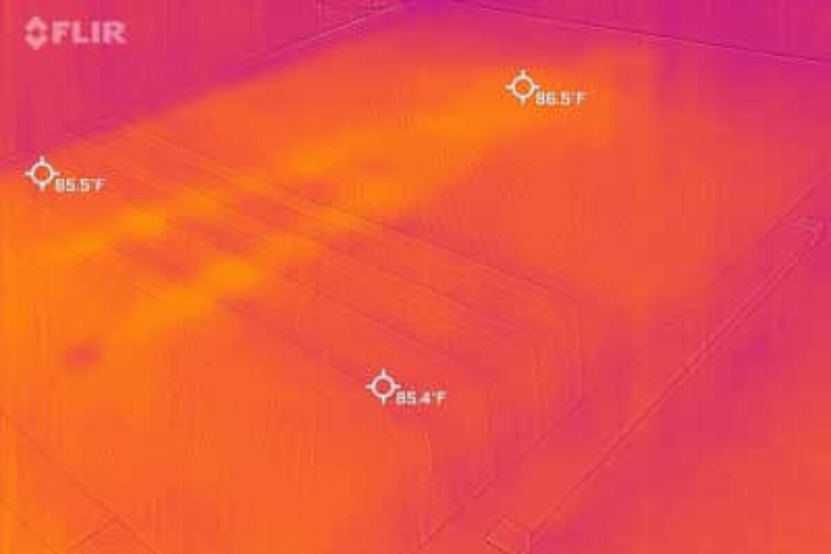 A heat image of a bed where a person laid down, barely visible.