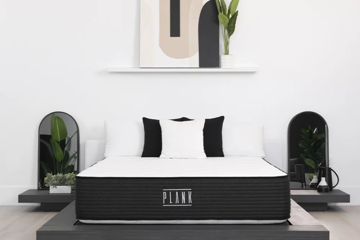 front view of a plank mattress on a modern platform bed highlighting its minimalist design and firm sleep surface