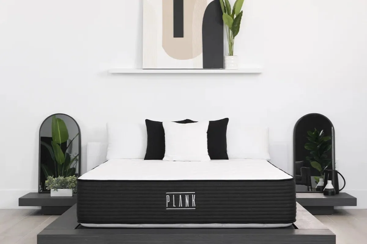 How Safe is the Plank Firm? Facts Revealed front view of a plank mattress on a modern platform bed highlighting its minimalist design and firm sleep surface