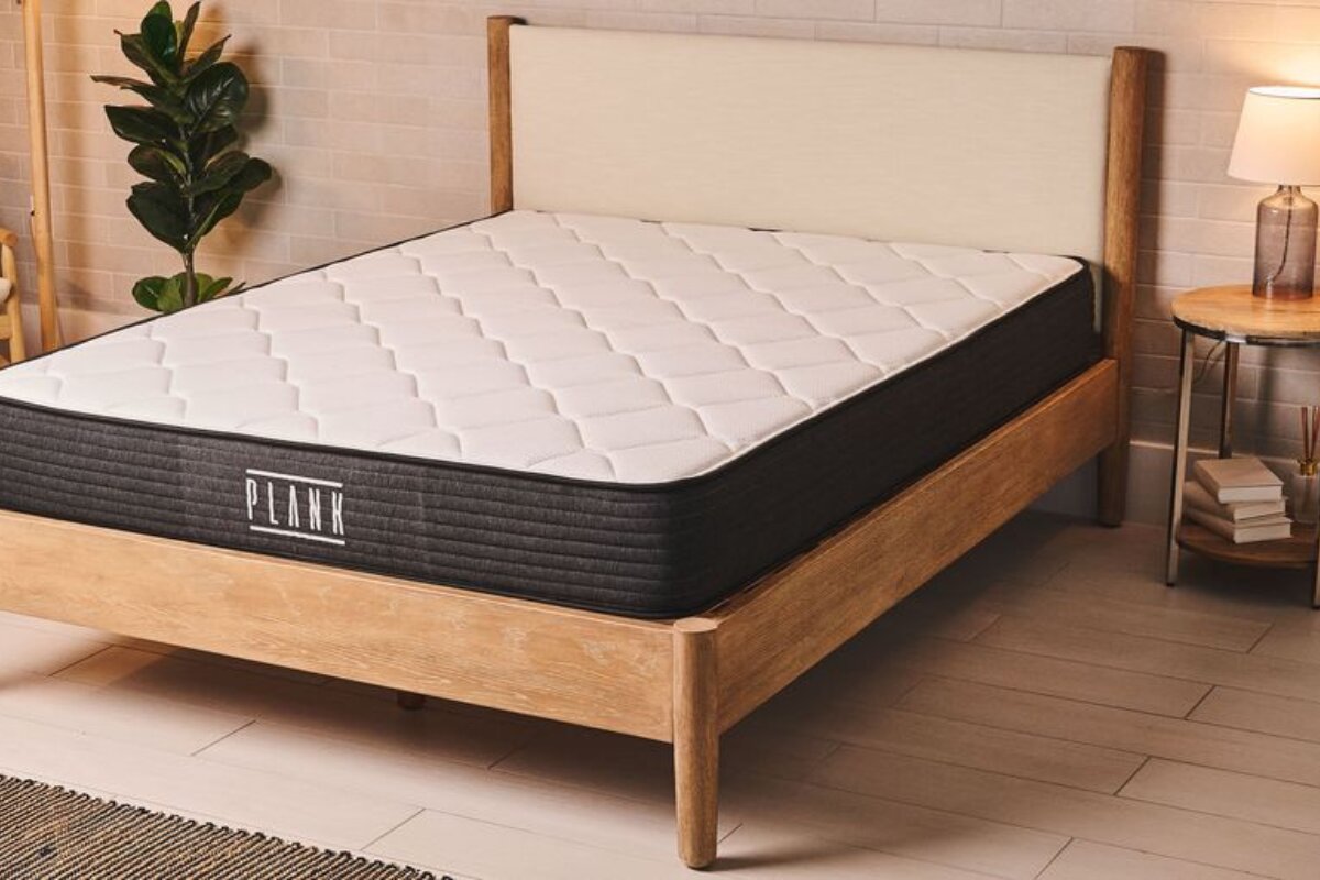 plank mattress on a wooden bed frame in a cozy bedroom highlighting its firm construction and clean design