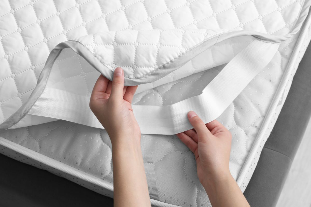 Twin XL Mattress Cost: Exploring Different Price Ranges Close-up of mattress protector on Twin XL bed showing added cost factors and accessories