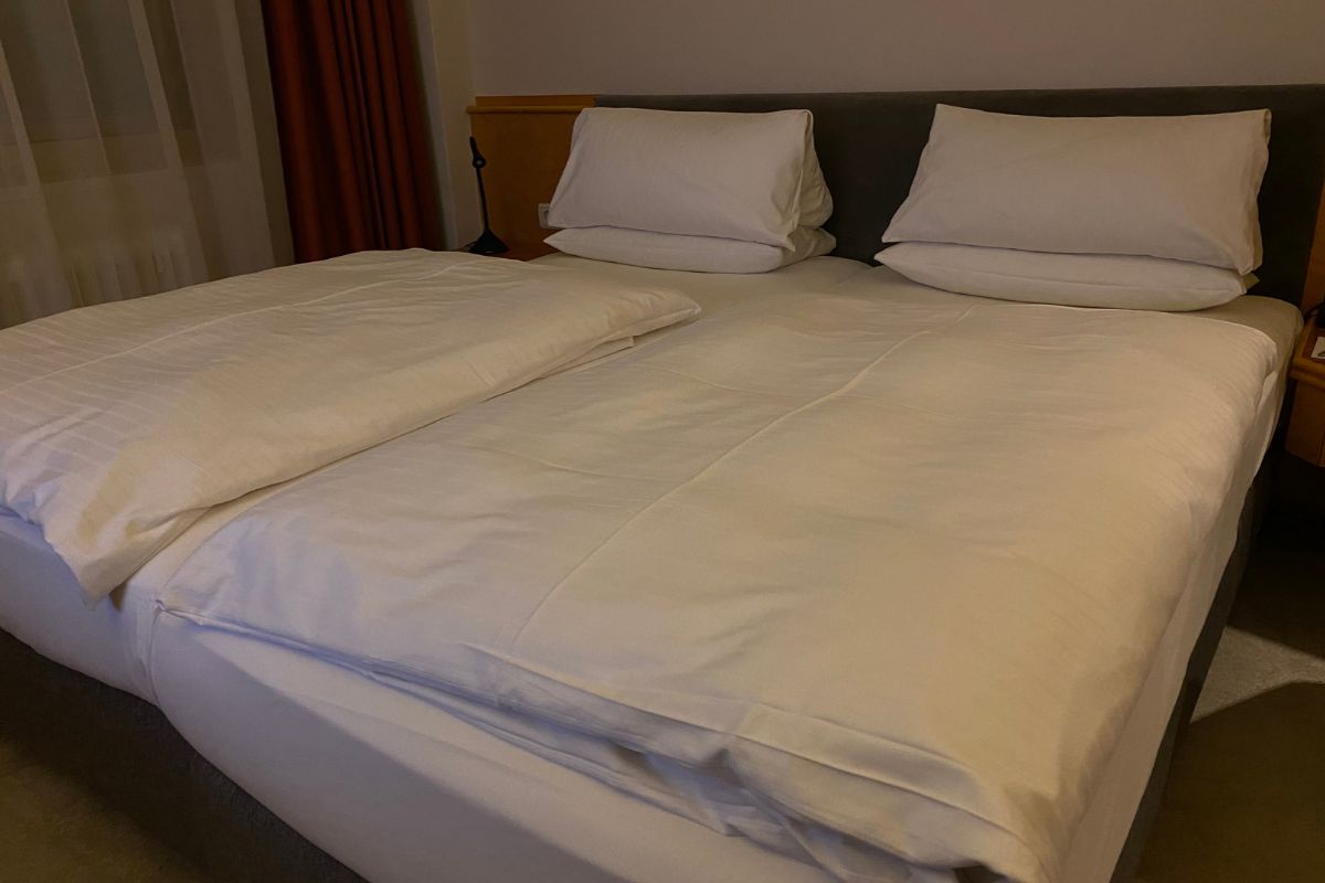 Two twin XL mattresses pushed together showing how they form a larger king size sleeping surface