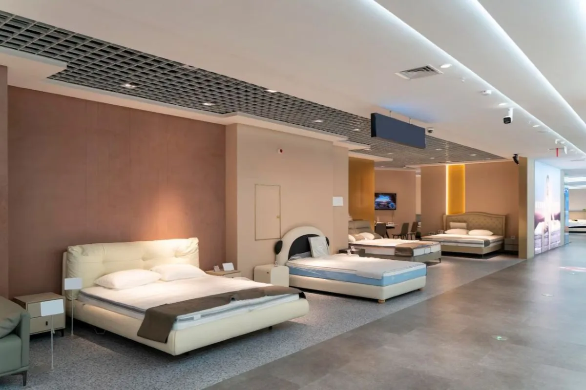 Modern mattress retail store featuring different firm bed options for shoppers
