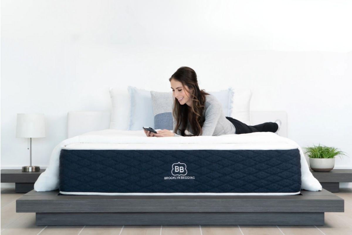 How to Sleep Better: Proven Tips to Improve Sleep Quality Woman relaxing on a Brooklyn Bedding mattress demonstrating mattress comfort and support for improved sleep quality