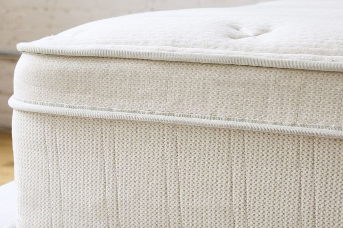 A close up of a hybrid mattress.