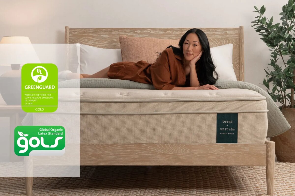 A woman lying down on the Leesa Natural Hybrid Mattress with the greenguard gold and gols certifiactions displayed.