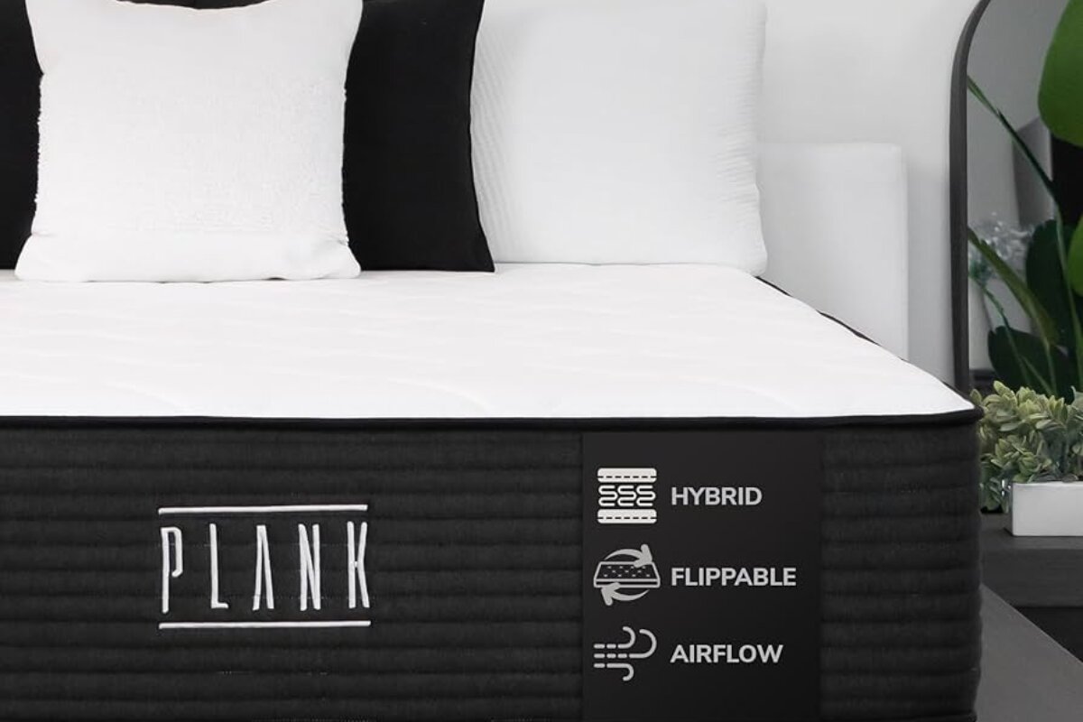 How Safe is the Plank Firm Luxe? Facts Revealed plank firm luxe hybrid mattress with flippable design and airflow features displayed in a modern bedroom setting