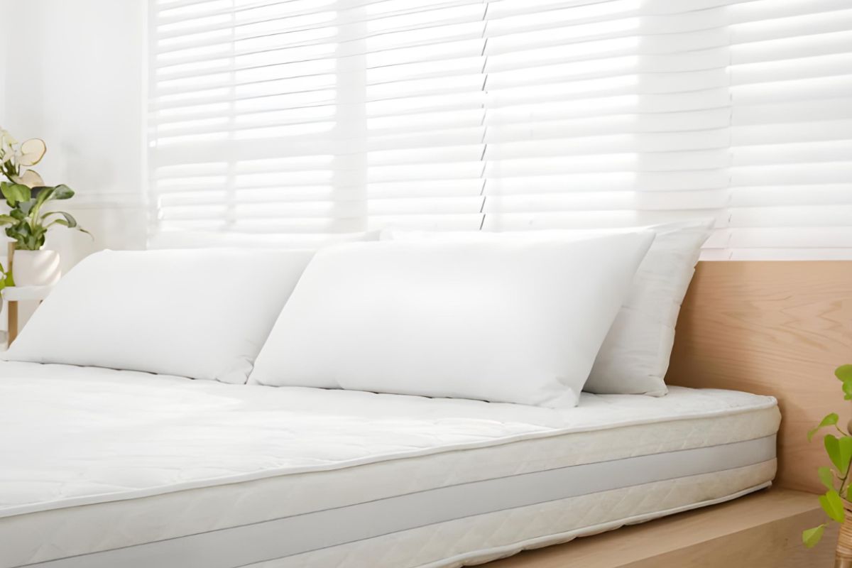 Medium soft mattress with plush white bedding showing a balance of cushioning comfort and gentle support for sleepers